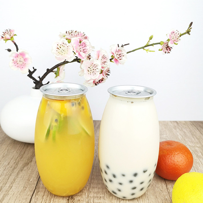 Le récipient en plastique clair de boîtes ouvertes faciles de 0,5 litres met les jus en bouteille pressés à froid de lait de thé